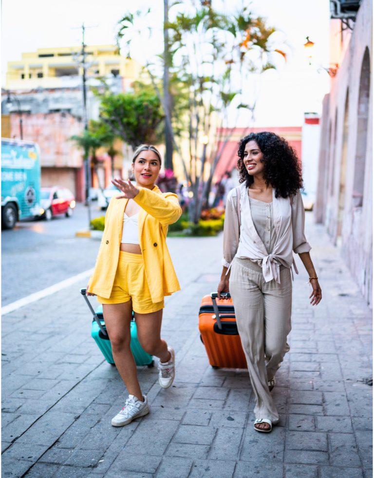Traveler young friends walking with luggage