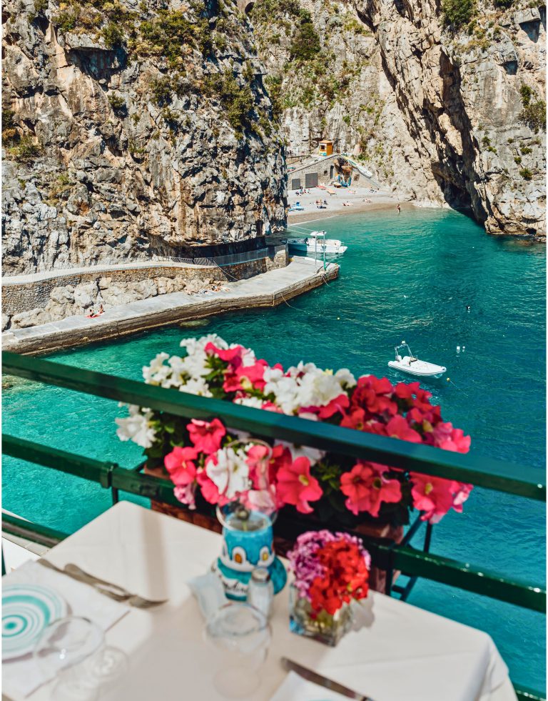 restaurant tables by the sea petunia flowers