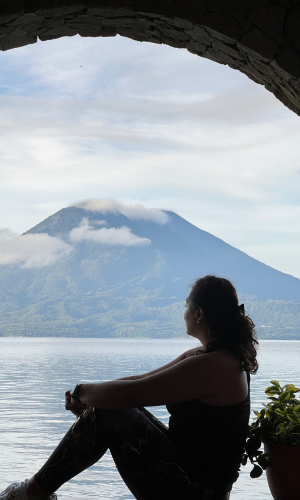 Woman contemplating Lake Atitlan.  Thinking about the sexual harassment endured a day before.