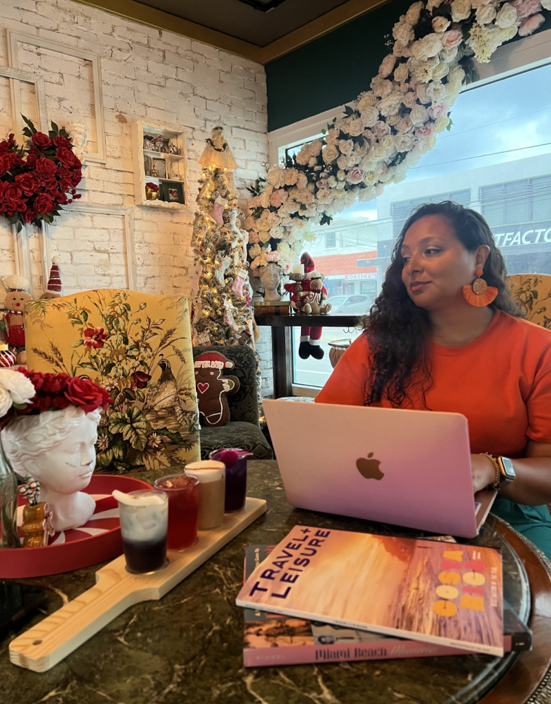 Woman at a coffee shop on her laptop