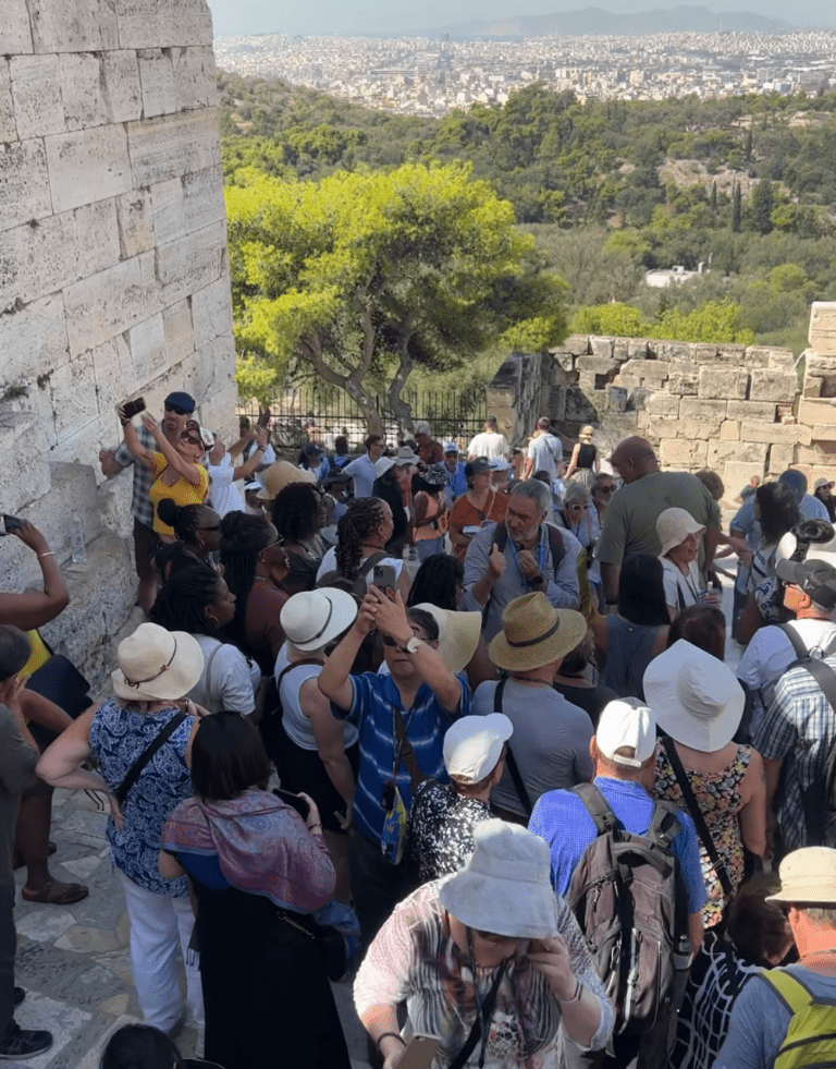 Crowds at the stairs of The Acropolis in Athens, Greece showing the impact of mass tourism
