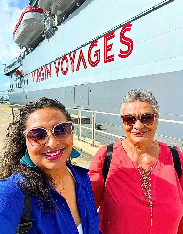 Author and her Mom posing outside of a Virgin Voyages Halloween Cruise