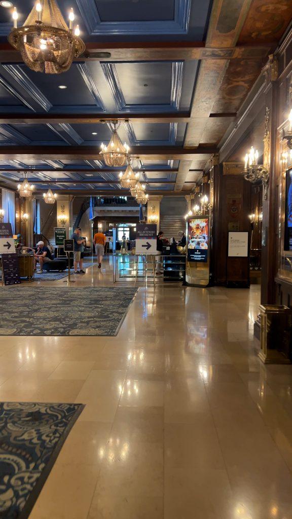 Fairmont Château Frontenac Review - Lobby - decorated with wood and gold accents.