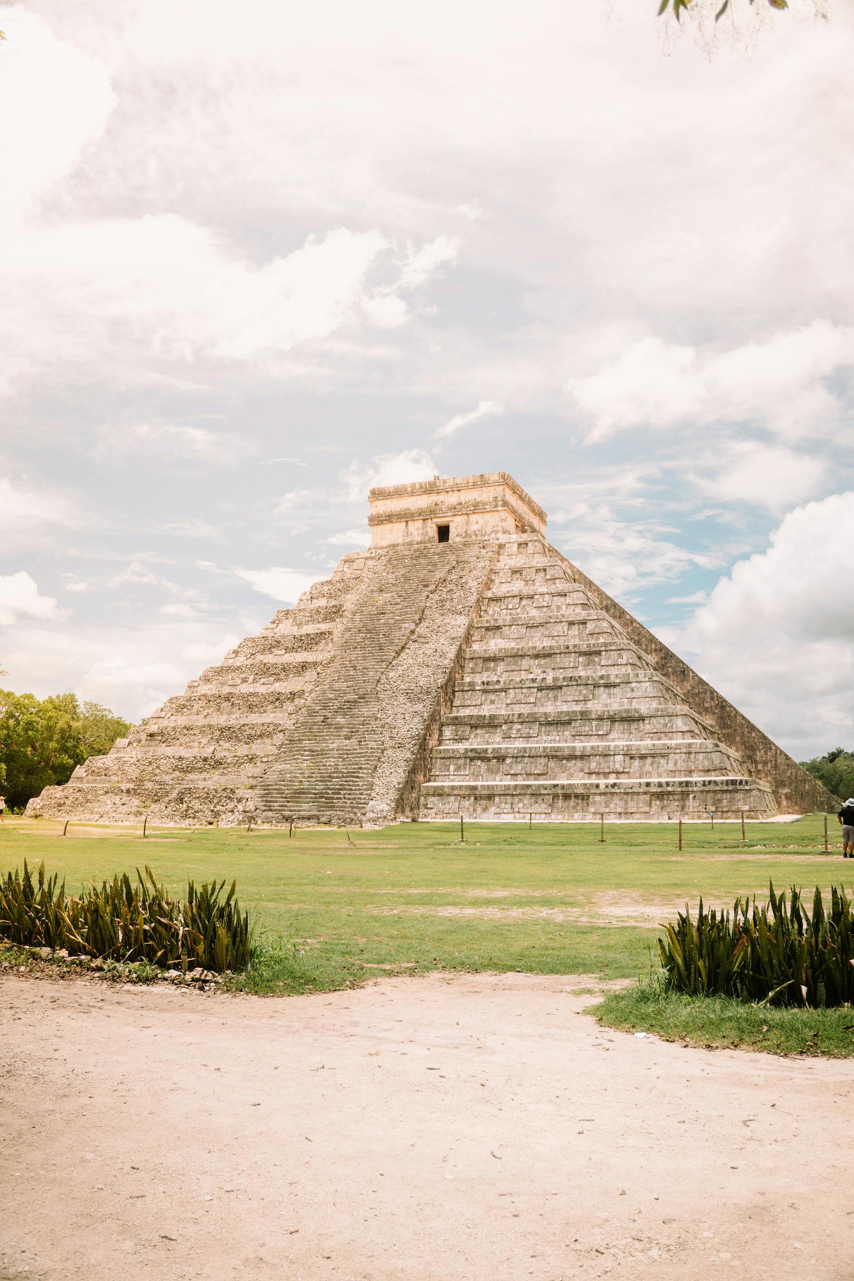 View of the El Castillo pyramid in Chichen Itza, an iconic Mayan architecture in Mexico.