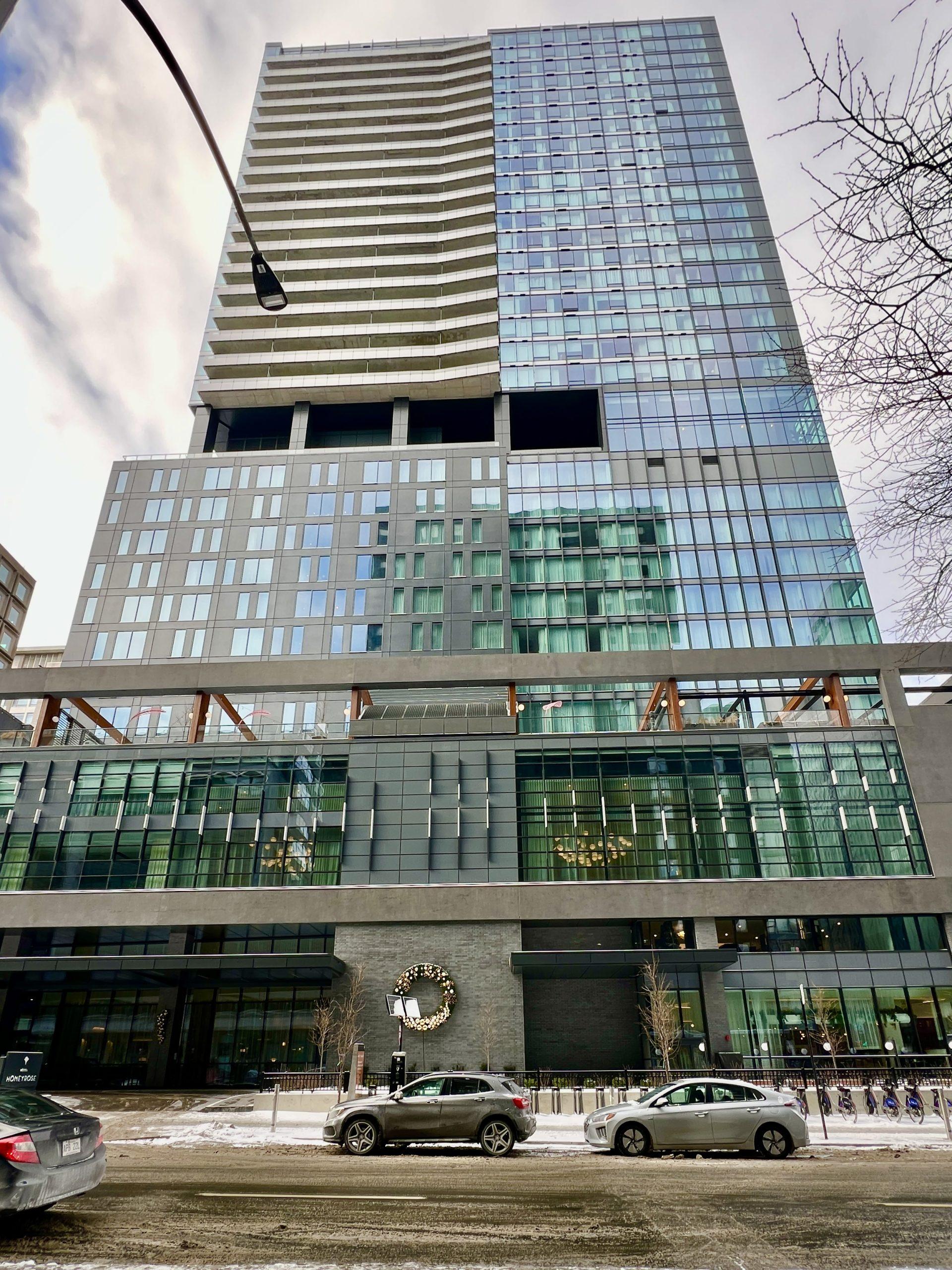 Exterior of HONEYROSE Hotel Montréal, a boutique hotel in Quartier des Spectacles featured in The Queen of Trips guide on where to stay in Montréal 2026.